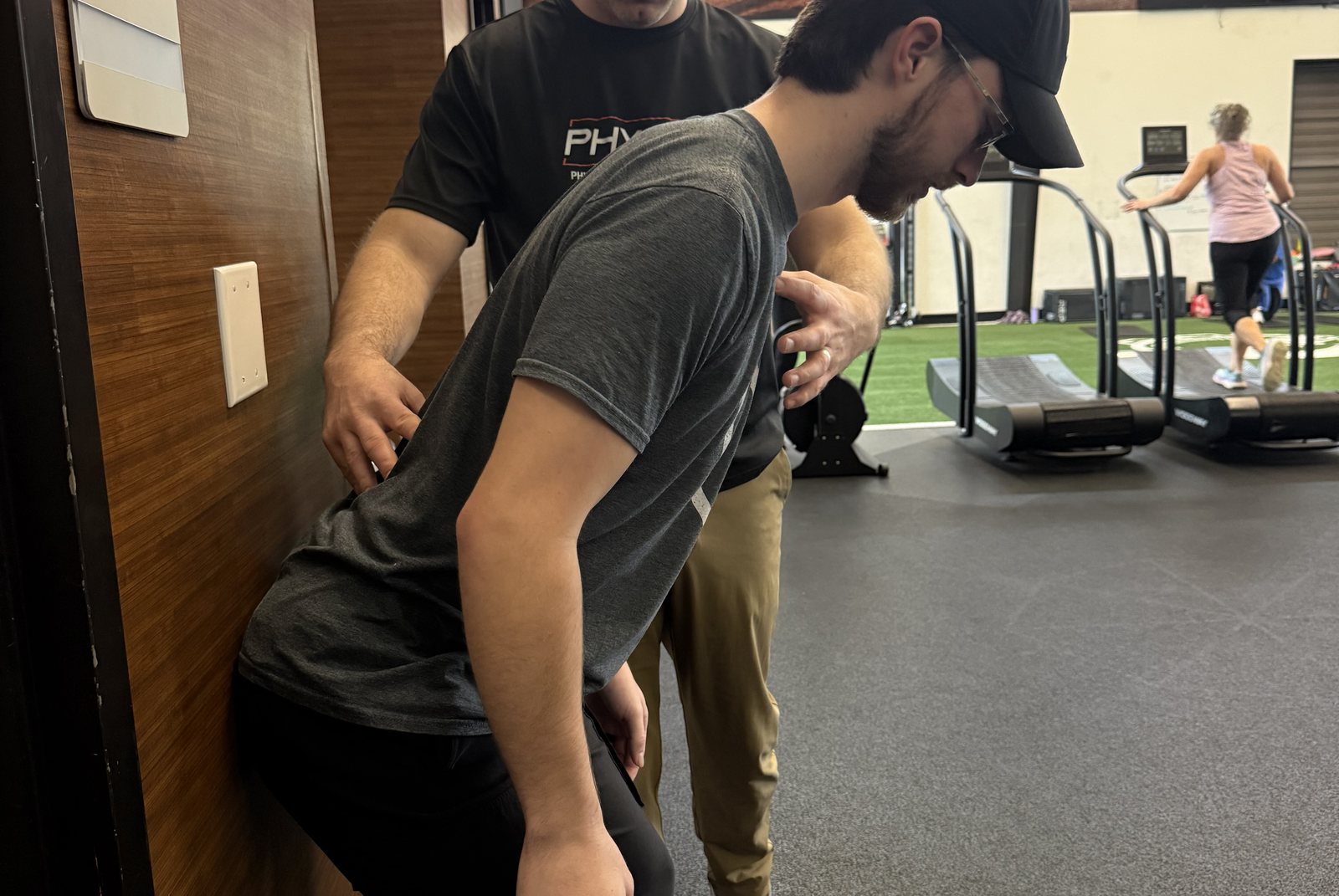 Hands-on manual therapy inside the Physio Plus clinic in Lindale, Texas